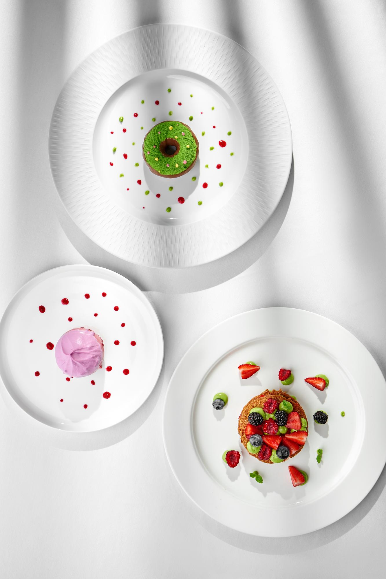 Three plated dishes on high-contrast bands